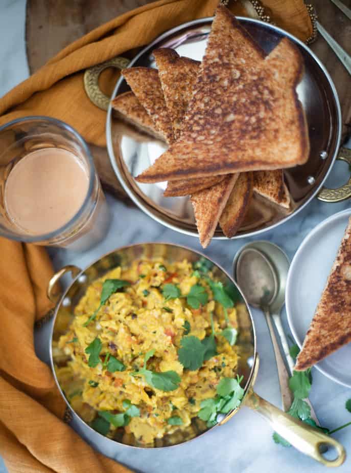 Indian style soft scrambled eggs cooked in spices  & served with toasted bread and chai
