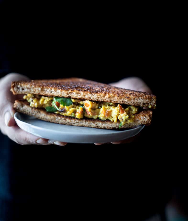 soft scrambled eggs sandwiched between toasted bread