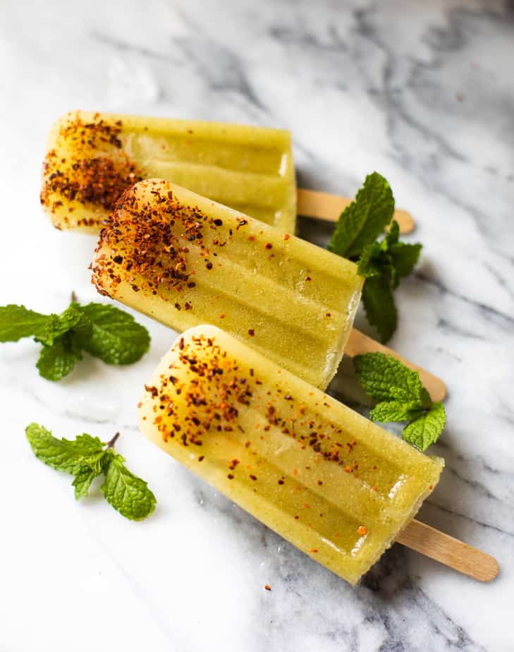 green mango popsicles with aleppo peppers and mint
