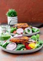 Fish in tandoori spices with a spring salad and onions
